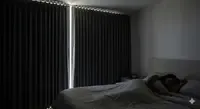 Cozy dark bedroom with blackout curtains